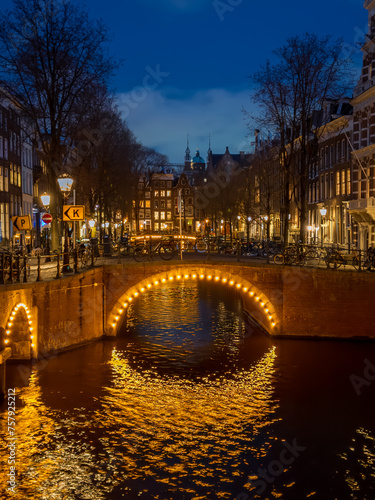 Bridges illuminated at night on the Keizersgracht canal in Amsterdam in winter