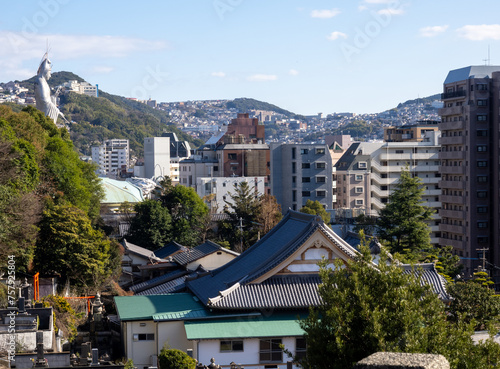 City view of Nagasaki from Nishizaka hill with roofs of Shorinzan Honrenji and Kannon statue of Fukusaiji temple at the distance - Nagasaki prefecture, Japan