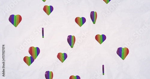 Image of rainbow hearts over white background