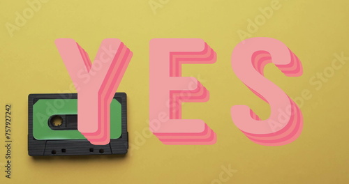 Image of yes text over tape on yellow background