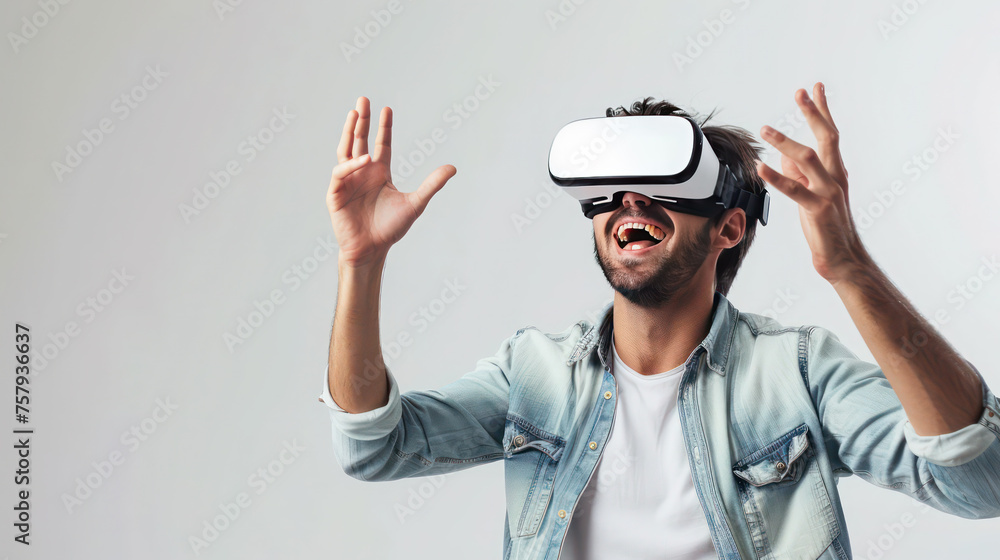 Young amuzed smiling man wearing VR glasses rasing hands Young amuzed smiling man wearing VR glasses rasing hands