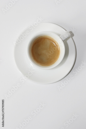 Cafe. Cup of Espresso Coffee on White Background  Top View. 