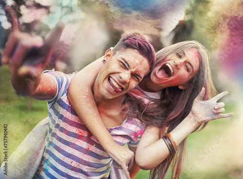 Happy  powder paint and couple portrait with rock hand sign with Holi festival and colorful event with smile. Celebration  love and excited in nature with fun people and crazy color dust for party