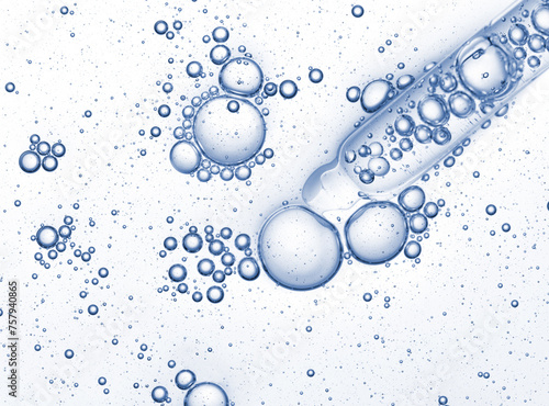 Pipette with blue niacinamide serum oil sample swatch texture with bubbles. Cosmetic Hyaluronic acid retinol science lab product