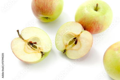 Half and whole of green apples isolated on white background with clipping path..