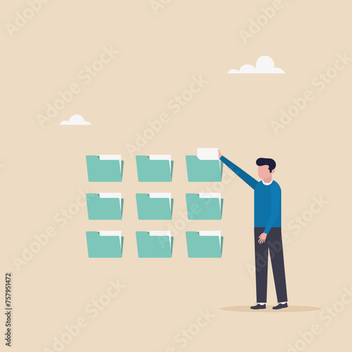 Documentation concept, businessman organizes document file into archival folders. A document for indexing, administrative work, scheduling, or file management.
