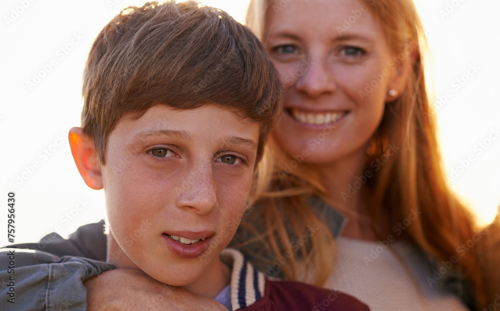 Portrait, son and mother person with summer sunset, family and smile for happy parent. Child, boy or teenager with affection or hug from loving mom people, bonding and love with lens flare in nature Portrait, son and mother person with summer sunset, family and smile for happy parent. Child, boy or teenager with affection or hug from loving mom people, bonding and love with lens flare in nature