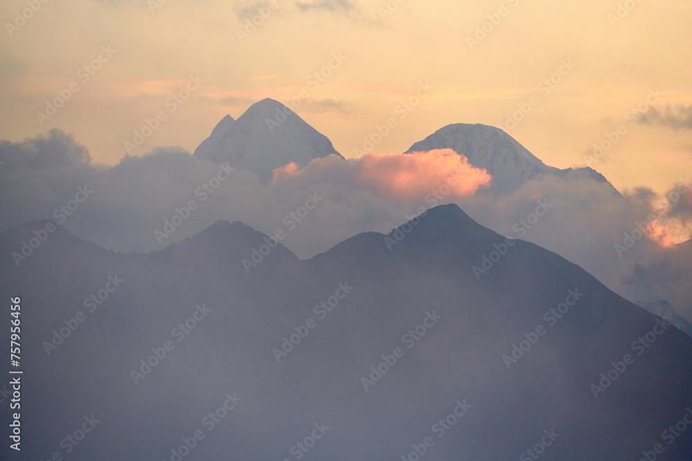 Belukha Mountain.
Belukha Mountain is the highest peak of the Altai Mountains. View of snow-capped peaks in the sunset light.  Katon-Karagay National Park. Kazakhstan.
