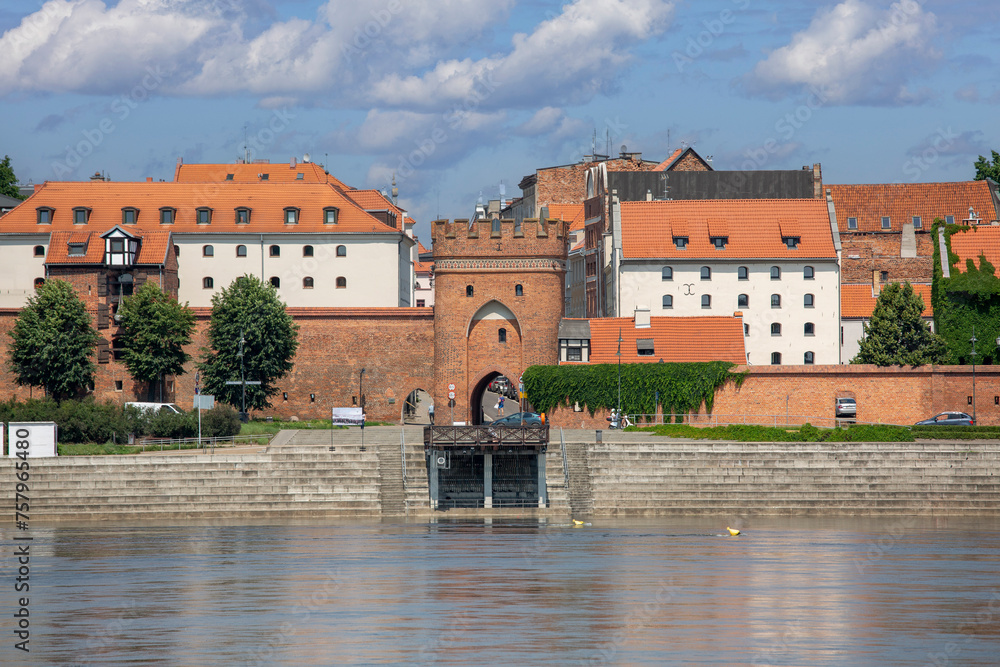 Obraz premium Vistula River view from viewing platform of the Old Town with Bridge Gate, Torun, Poland