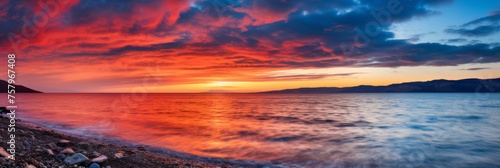 Tranquil and serene panoramic view of a sunset sky displaying calming and soothing colors © Roman Enger