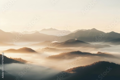 Fog coming in over mountains at sunrise