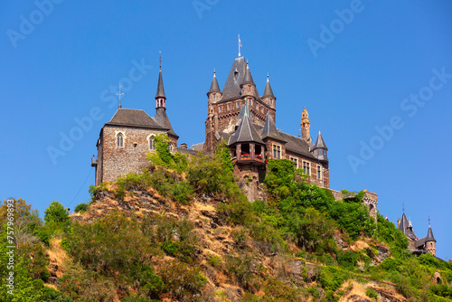 Sunny Reichsburg castle in Cochem, beautiful town on romantic Moselle river, Germany