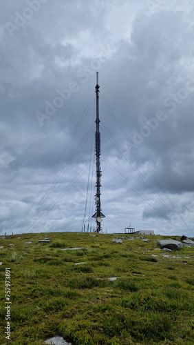 Atop the majestic peak of Kippure, a towering television and radio transmitter mast stands sentinel, reaching towards the sky like a modern-day beacon. 