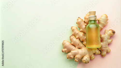 Ginger Essential Oil Bottle with Fresh Ginger Root on Green Background
