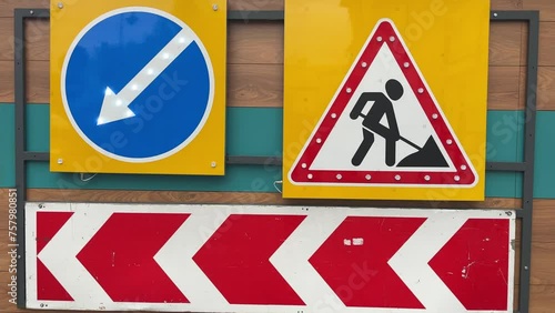 Road Repair Sign and Detour Sign on the Roadside at Night on the Track
