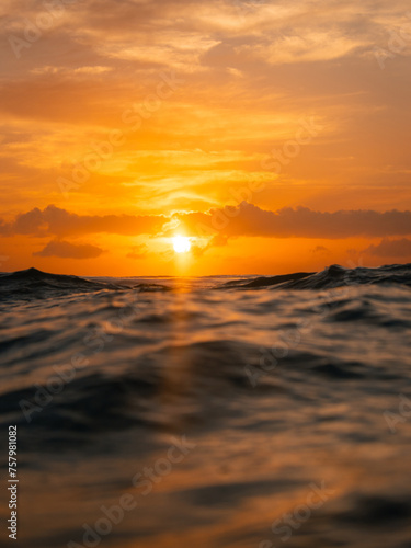 Scenic sunrise view from the ocean surface.