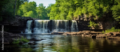 Majestic Waterfall Cascading Down Rocks in a Serene and Breathtaking Natural Setting