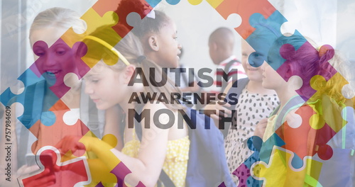 Image of autism awareness month text over diverse schoolchildren using smartphone