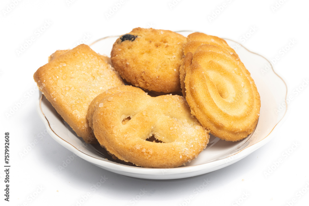 Group of assorted of danish butter cookies in a small white plate isolated on white background clipping path
