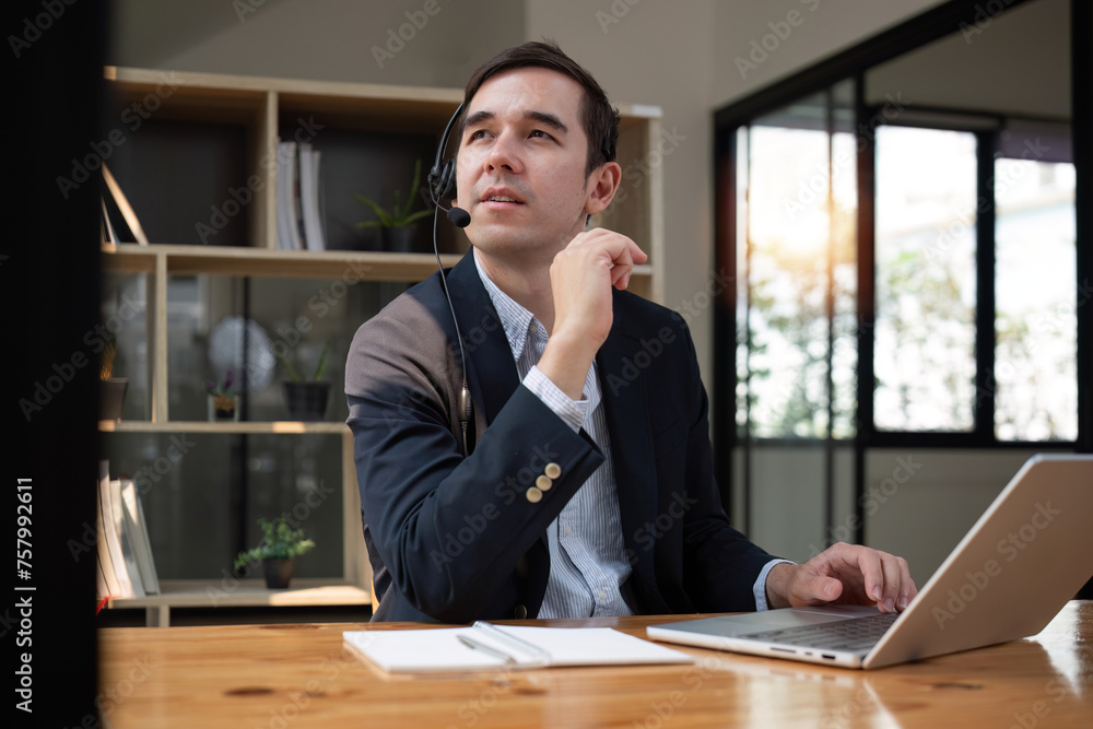 Call center operator or customer service representative with headset sitting at table in office Telemarketing Technical Support Sales Representative Call center operator or customer service representative with headset sitting at table in office Telemarketing Technical Support Sales Representative