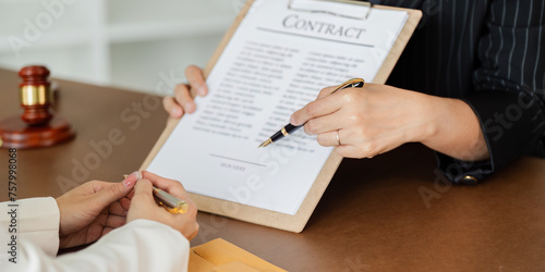Hand of lawyer pointing at document agreement, contract for businessperson, client signing contract