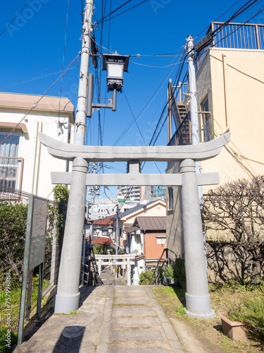Stone torii gate at the entrance to Umezono Migawari Tenmangu Shrine in Maruyama district of Nagasaki, Japan