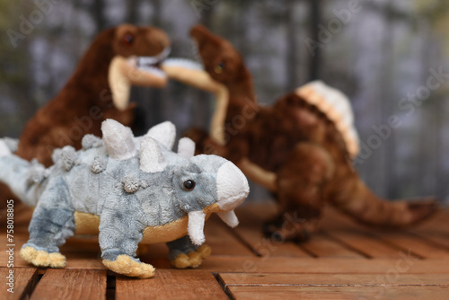 Soft toys in the form of dinosaurs