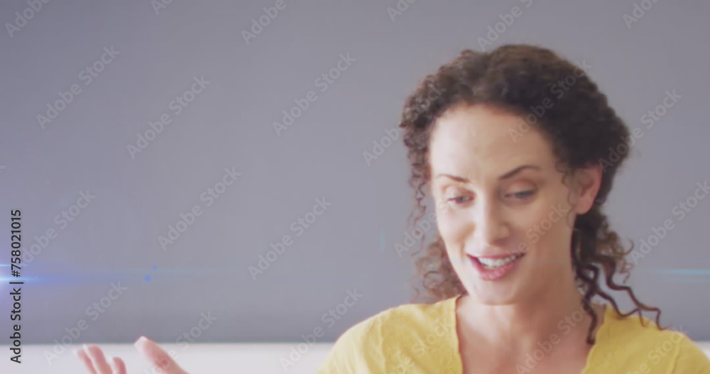 Image of light trails over caucasian female teacher Image of light trails over caucasian female teacher