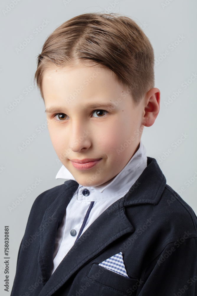 Portrait of a funny boy in retro style with a classic hairstyle and in a suit. Portrait of a funny boy in retro style with a classic hairstyle and in a suit.