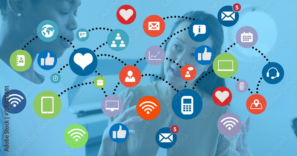 Image of connections with tech icons over diverse female coworkers in office Image of connections with tech icons over diverse female coworkers in office