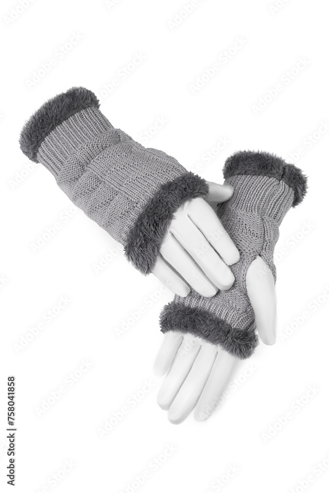 Close-up shot of a gray warm fingerless gloves. A pair of short women's mittens with fur is isolated on a white background. Top view. Close-up shot of a gray warm fingerless gloves. A pair of short women's mittens with fur is isolated on a white background. Top view.