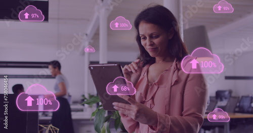 Image of cloud data processing over biracial businesswoman in office