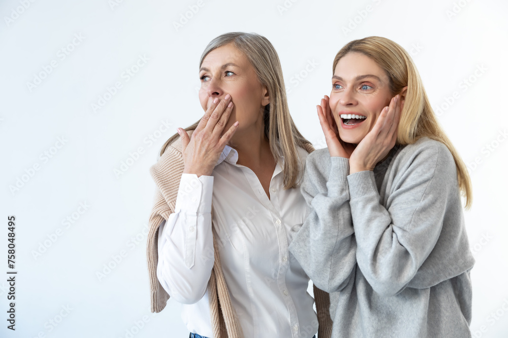 Two women discussing something and looking impressed Two women discussing something and looking impressed