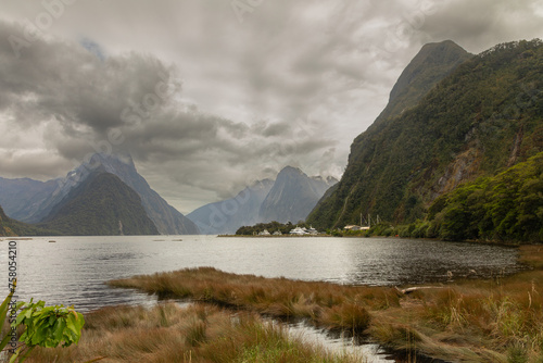 The spectacular Milford Sound, one of the wettest places on the planet, is seen under typically heavy skies in Fiordland, New Zealand. photo