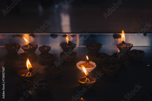 Candle for praying, Batu Caves, Hindu Temple in Malaysia. Light on candles at Murugan Temple.