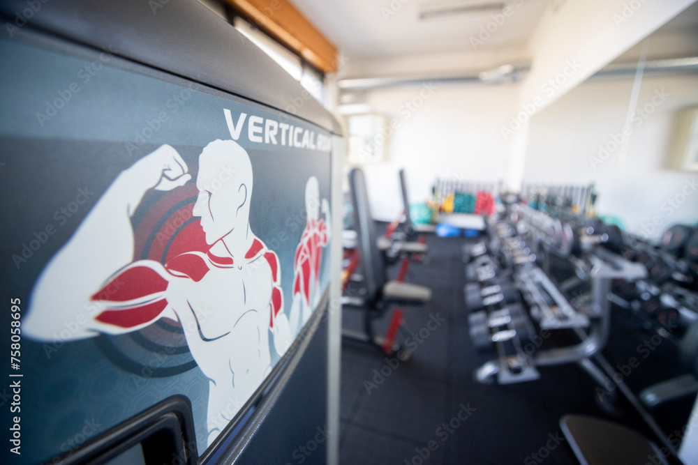 equipment room of a gym with specification of the muscles used