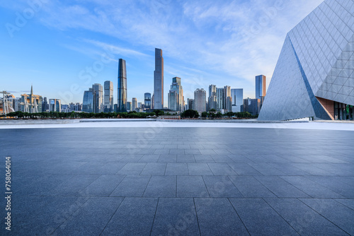 Empty square floors and city skyline with modern buildings at sunrise in Guangzhou