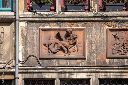 Relief of decorative facade of historic tenement house at Kraanlei street, Ghent, Belgium photo