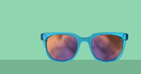 Image of different sunglasses icons on green black background