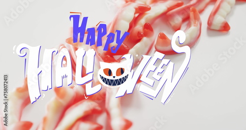 Image of happy halloween text with cat over teeth sweets