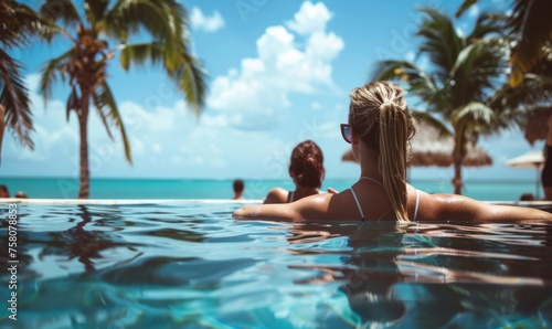 Women relaxing in the pool and basking in the summer sun