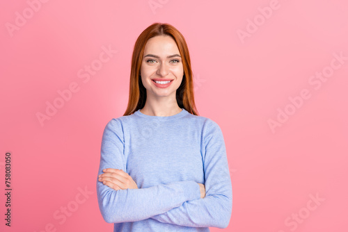 Portrait of good mood toothy beaming girl with foxy hairdo wear blue pullover holding hands crossed isolated on pink color background
