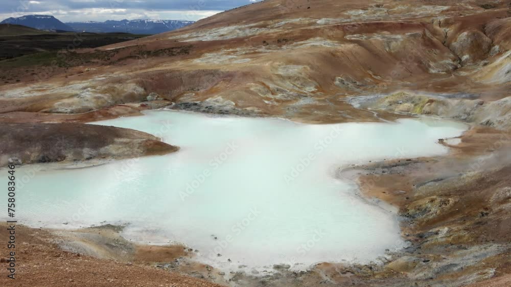Hot bubbling springs with steam and water on the sulphur fields of Iceland. Hot bubbling springs with steam and water on the sulphur fields of Iceland.