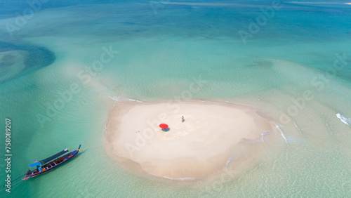 Aerial view of Koh Pah, unseen island in Khao Lak, Thailand, that is often called Thai Maldives. Private picnic on the uninhabited island for a couple. 