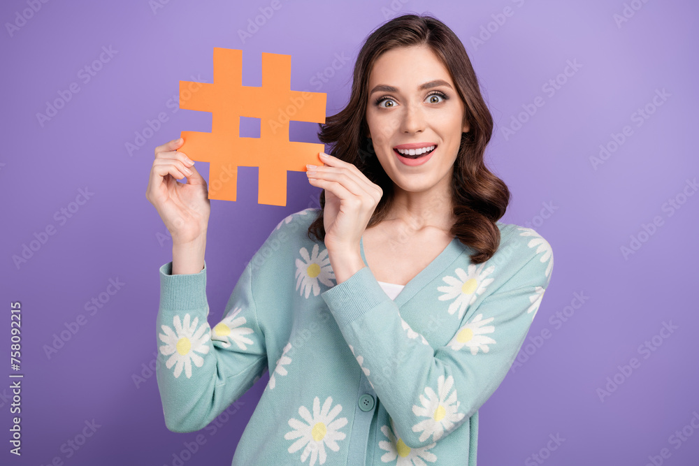 Photo of funky impressed lady dressed flower print cardigan showing hash tag postcard isolated violet color background Photo of funky impressed lady dressed flower print cardigan showing hash tag postcard isolated violet color background