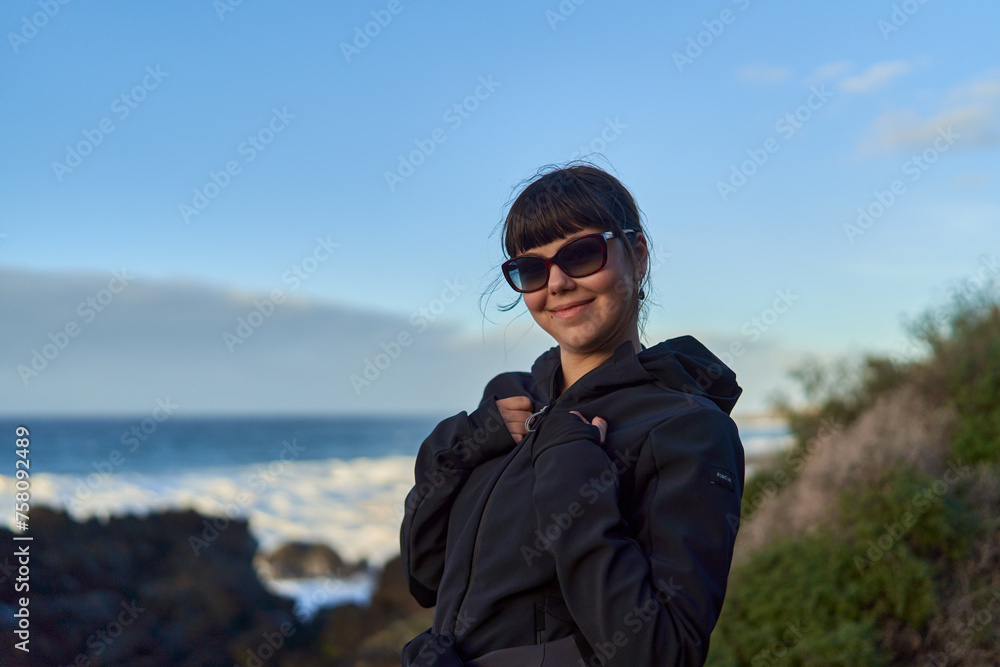 Young happy woman in Tenerife on the shore Young happy woman in Tenerife on the shore