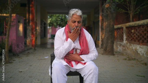 Grey-haired Indian man coughing badly - lungs infection  weak lungs  asthma  flu infection  seasonal infection . Sick asian grandfather suffering from throat pain and dry cough - village lifestyle ...