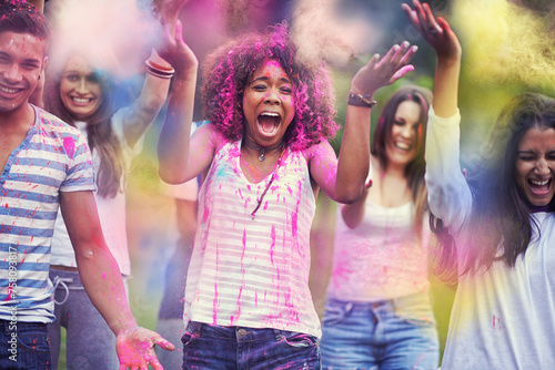 Friends, excited and powder paint at color festival in park, happiness and fun with celebration or party outdoor. Freedom, cheers and colorful mess, joy and culture with people at summer event