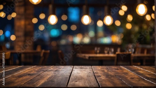 Empty wooden table top with lights bokeh on blur restaurant background photo