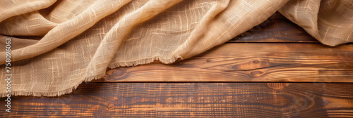 a wooden table with burlap fabric . Web banner with copy space . top view, 